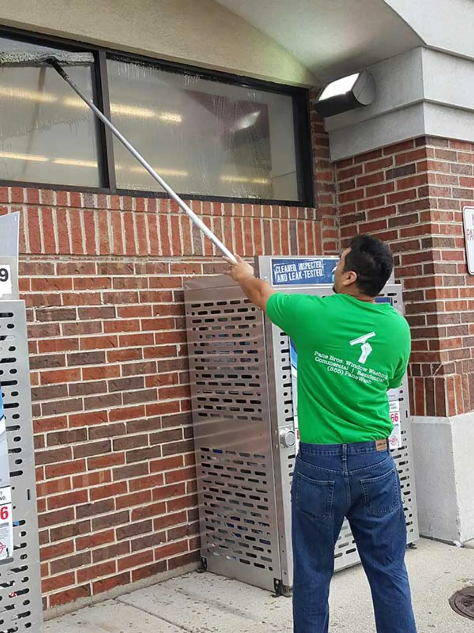 Pane Bros crew cleaning commercial building windows